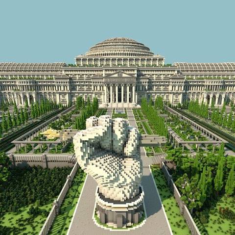 Screenshot of a Minecraft map, showing a statue of a closed fist over a pen, and a monumental white building in the background.